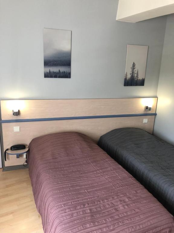 Postel nebo postele na pokoji v ubytování L'embellie