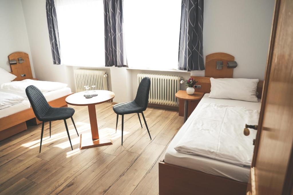 Postel nebo postele na pokoji v ubytování Hotel & Gasthof Wagner