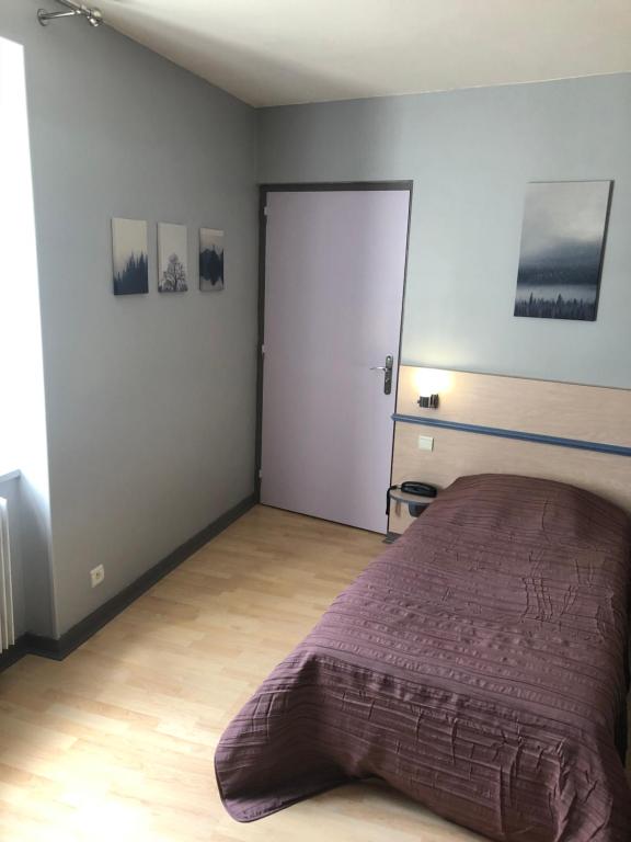 Postel nebo postele na pokoji v ubytování L'embellie