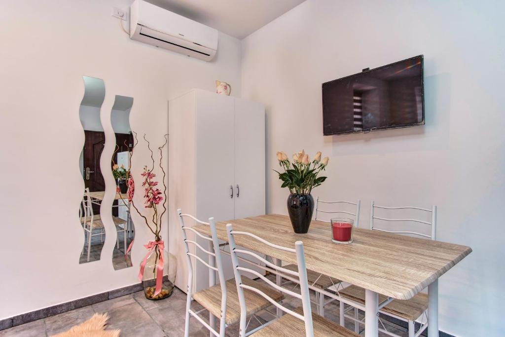 Televízia a/alebo spoločenská miestnosť v ubytovaní SkyGarden House