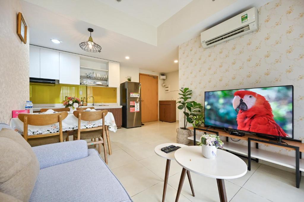 a living room with a large flat screen tv at High Class 2 Bedrooms Masteri Thao Dien Apartment, Fully Furnished With Full Amenities in Ho Chi Minh City