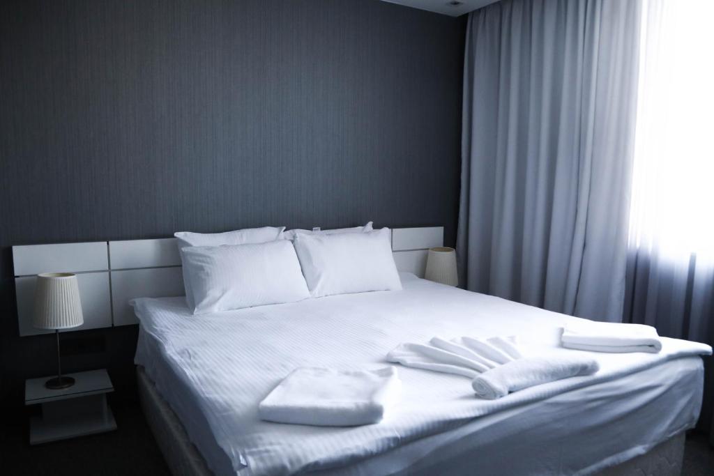 Postel nebo postele na pokoji v ubytování Boutique Hotel Kanyon