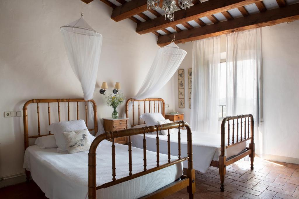 Postel nebo postele na pokoji v ubytování B&B Can Casadella