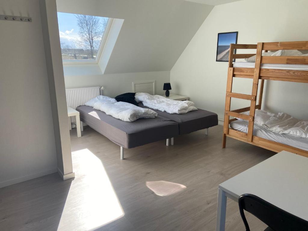 Postel nebo postele na pokoji v ubytování Oasen Samsø