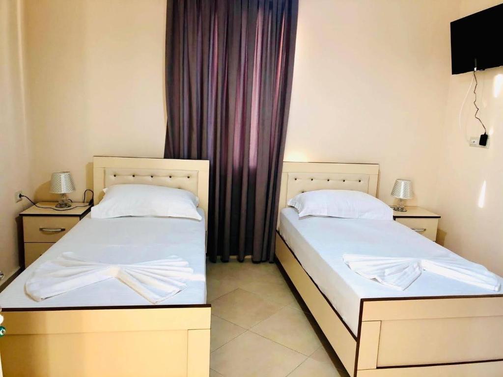 Postel nebo postele na pokoji v ubytování R HOTEL
