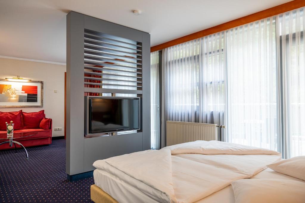 Postel nebo postele na pokoji v ubytování Koener Hotel & Spa