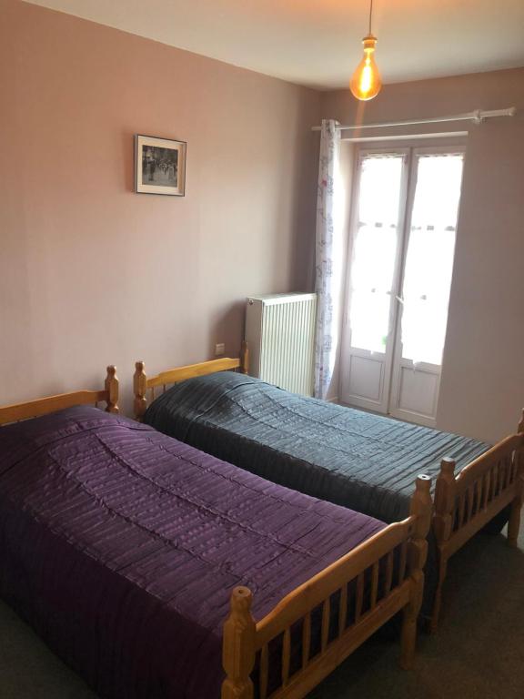 Postel nebo postele na pokoji v ubytování L'embellie