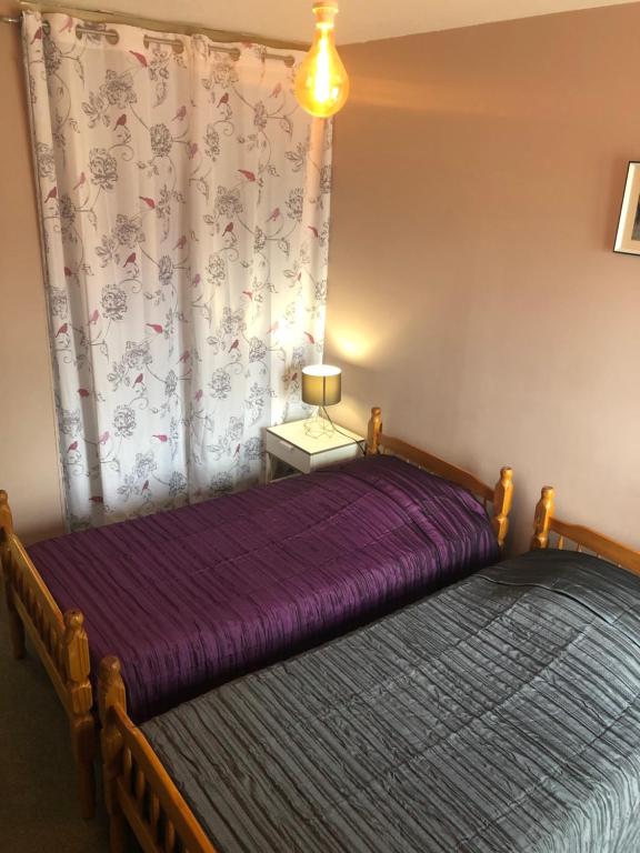 Postel nebo postele na pokoji v ubytování L'embellie