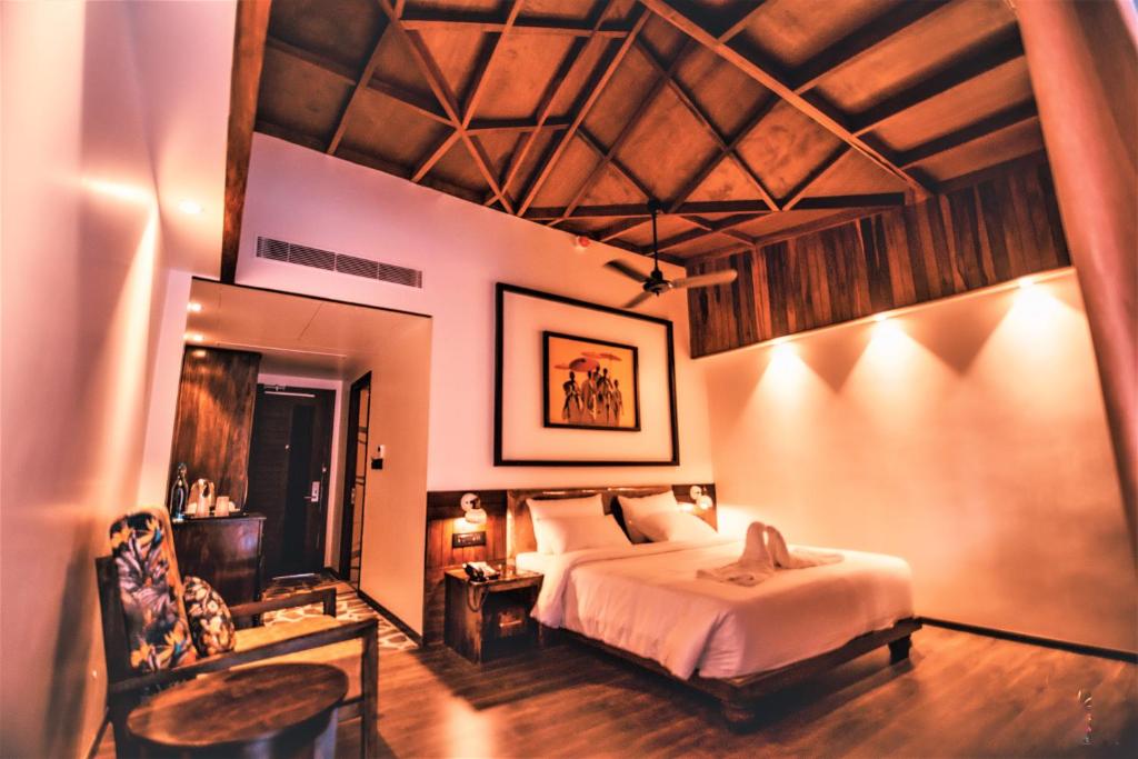 Voodi või voodid majutusasutuse Symphony Samudra Beachside Jungle Resort And Spa toas