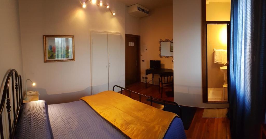 Postel nebo postele na pokoji v ubytování ALBERGO EUROPA