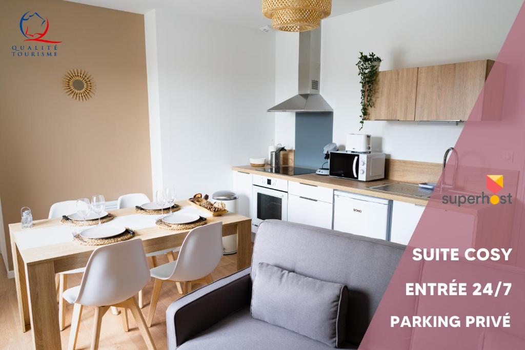 a kitchen and dining room with a table and chairs at Charmant appartement avec parking privé in Saumur