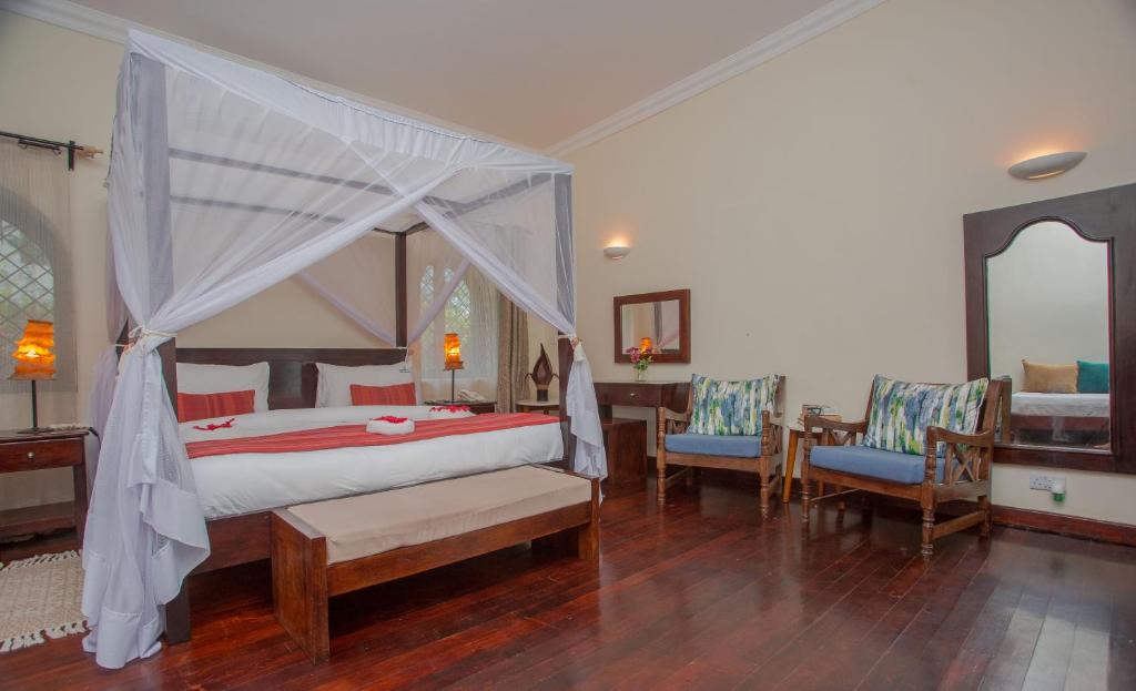 Postel nebo postele na pokoji v ubytování Mzima Beach Residences - Diani Beach