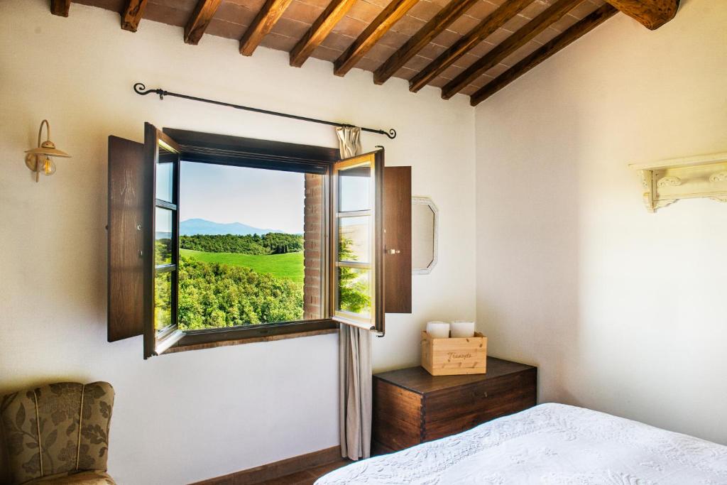 Postel nebo postele na pokoji v ubytování Agriturismo Pieve Sprenna