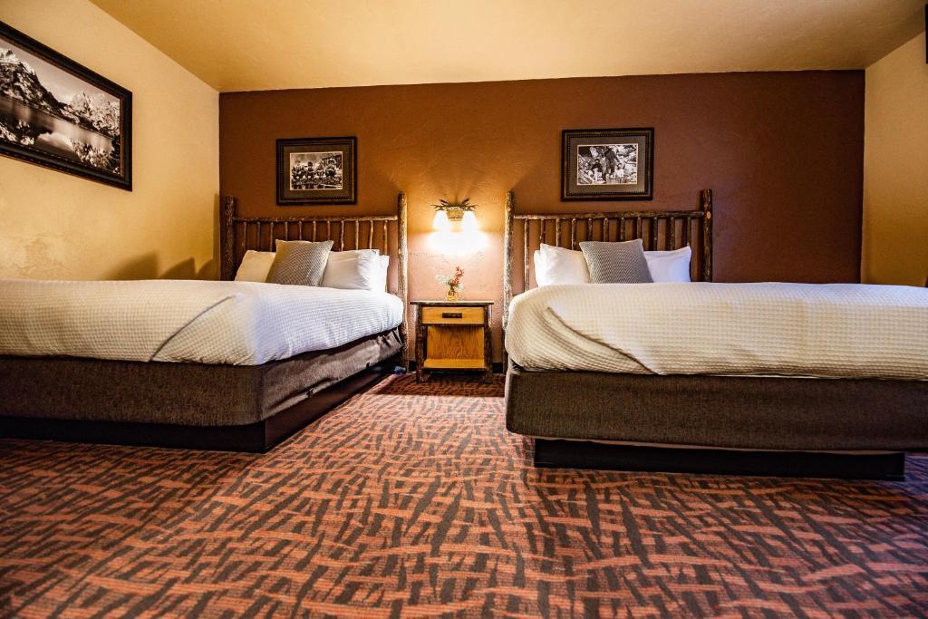 Postel nebo postele na pokoji v ubytování Elk Country Inn