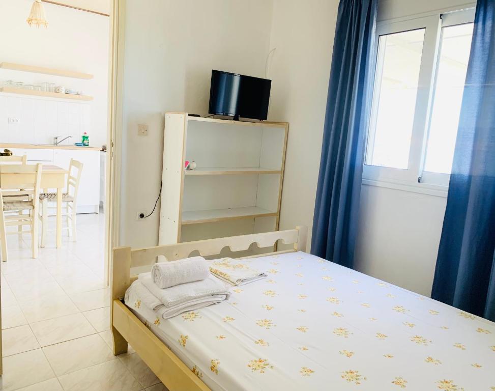 Posteľ alebo postele v izbe v ubytovaní Seaside Bungalows Petalidi