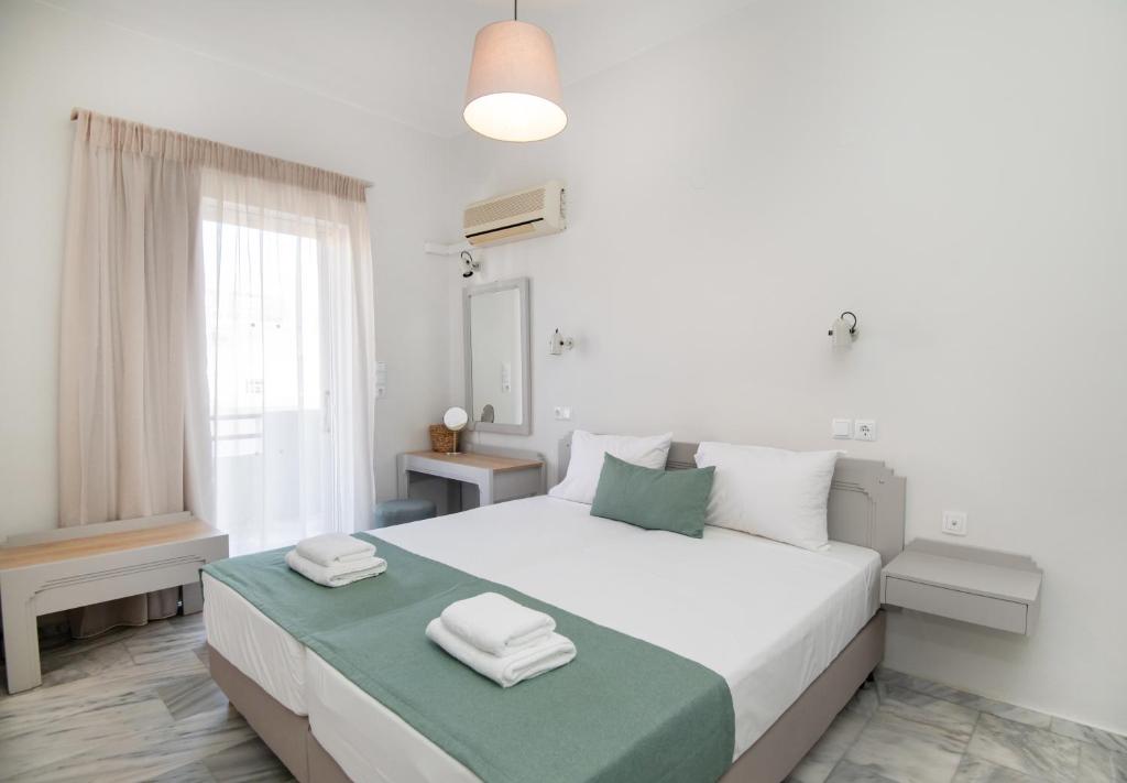 Postel nebo postele na pokoji v ubytování Mardinik Hotel Apartments