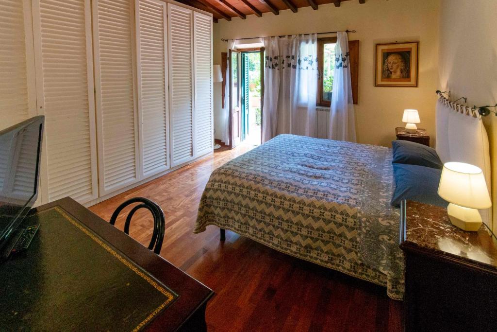 Postel nebo postele na pokoji v ubytování Casa Quaratesi