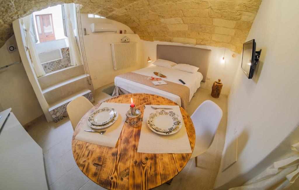 A bed or beds in a room at Le Antiche Dimore di Dea