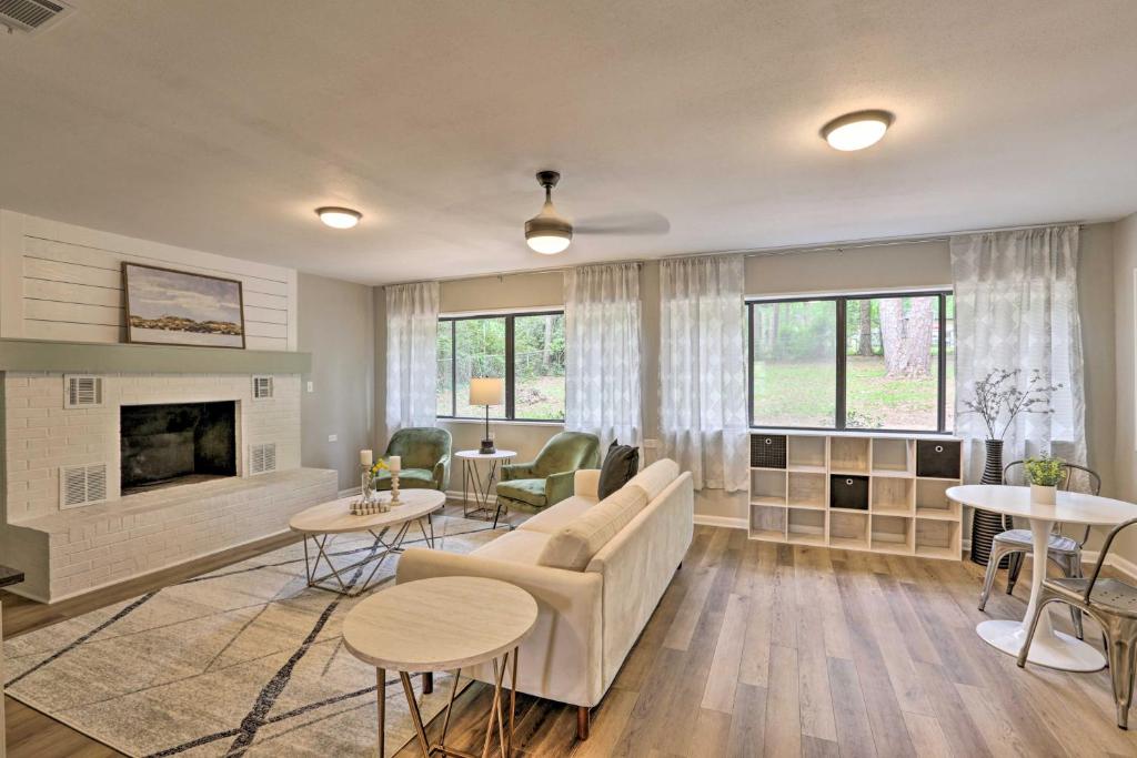 a living room with a couch and a fireplace at Stylish Sunshine State Escape - 2 Mi to FSU! in Tallahassee