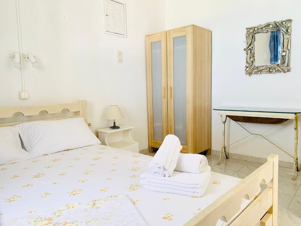Posteľ alebo postele v izbe v ubytovaní Seaside Bungalows Petalidi