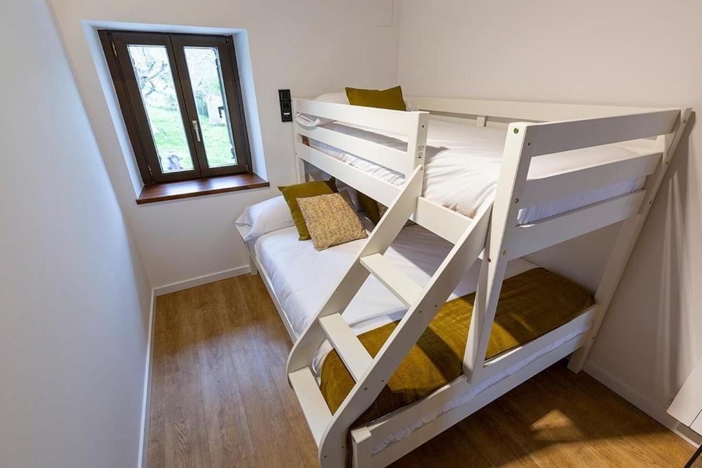 Postel nebo postele na pokoji v ubytování ARBELA Apartamentuak
