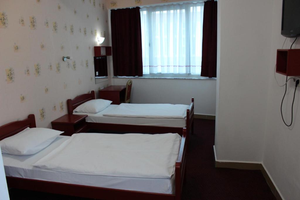 Postel nebo postele na pokoji v ubytování Hotel BM International