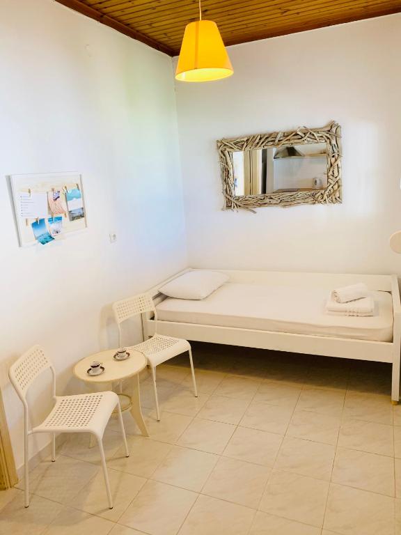 Posteľ alebo postele v izbe v ubytovaní Seaside Bungalows Petalidi