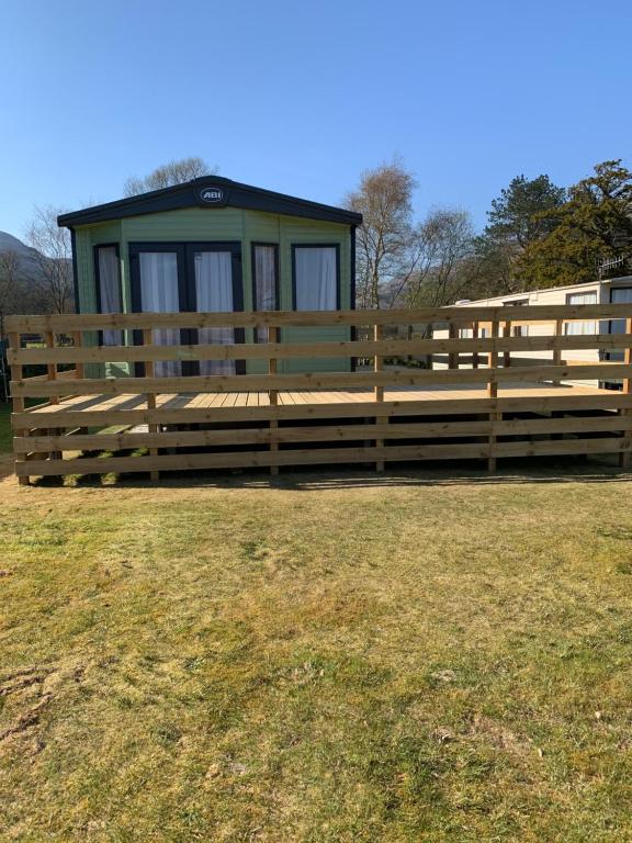 a large wooden fence in front of a building at The Rawcliffe in Dunoon