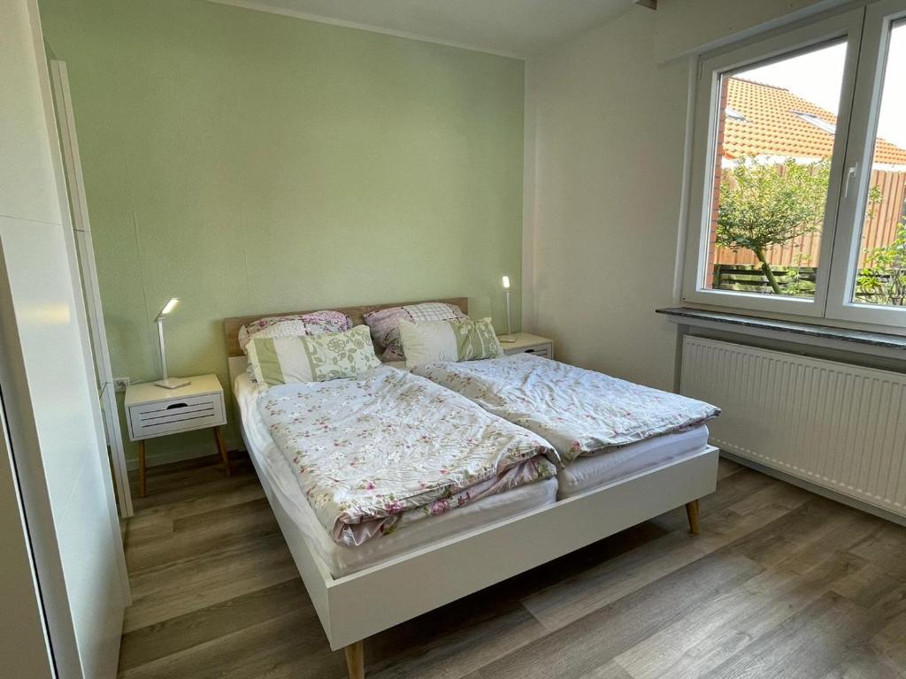 Postel nebo postele na pokoji v ubytování Haus Kormoran Borkum