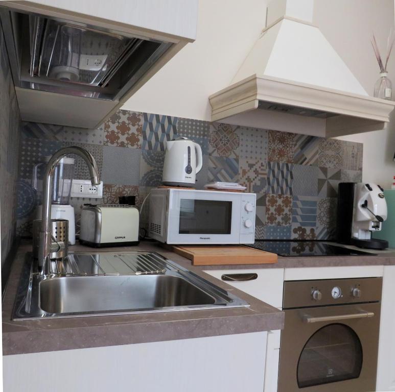 Kuchyň nebo kuchyňský kout v ubytování Domus D'Angelo B&B