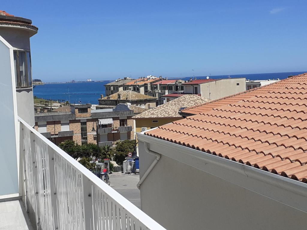 a view of a city from a balcony at Lo Scorcio sul mare in Marina San Vito
