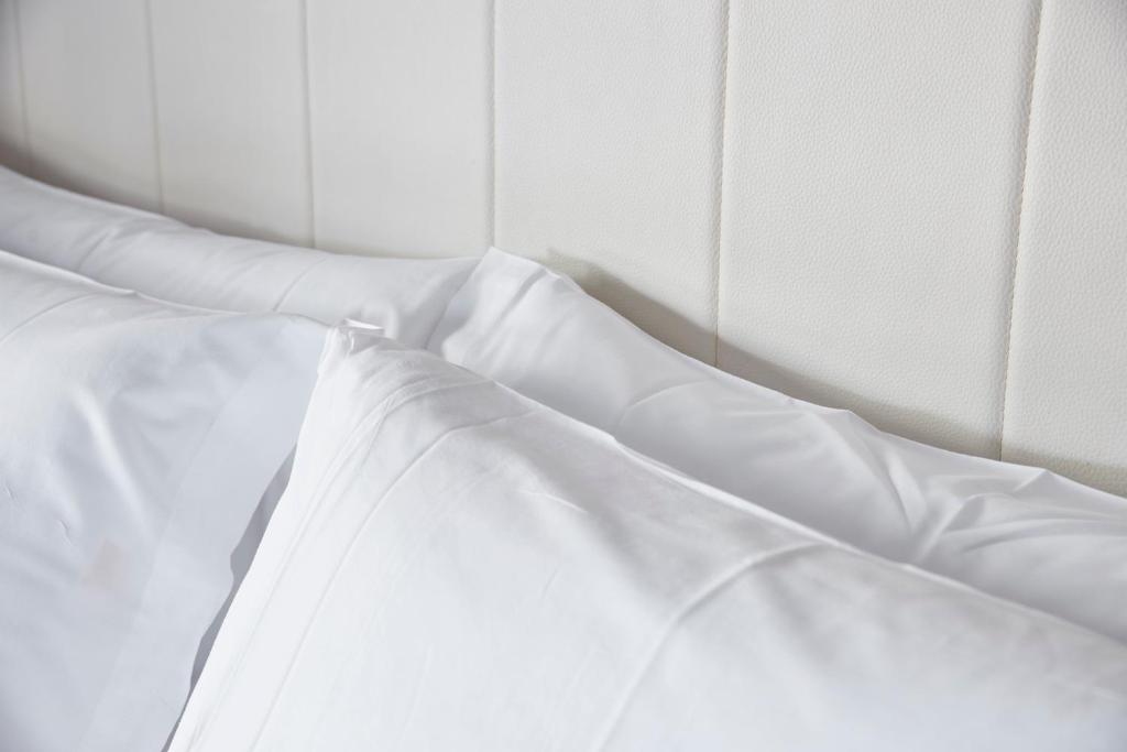 Postel nebo postele na pokoji v ubytování Hotel Arrizul Beach