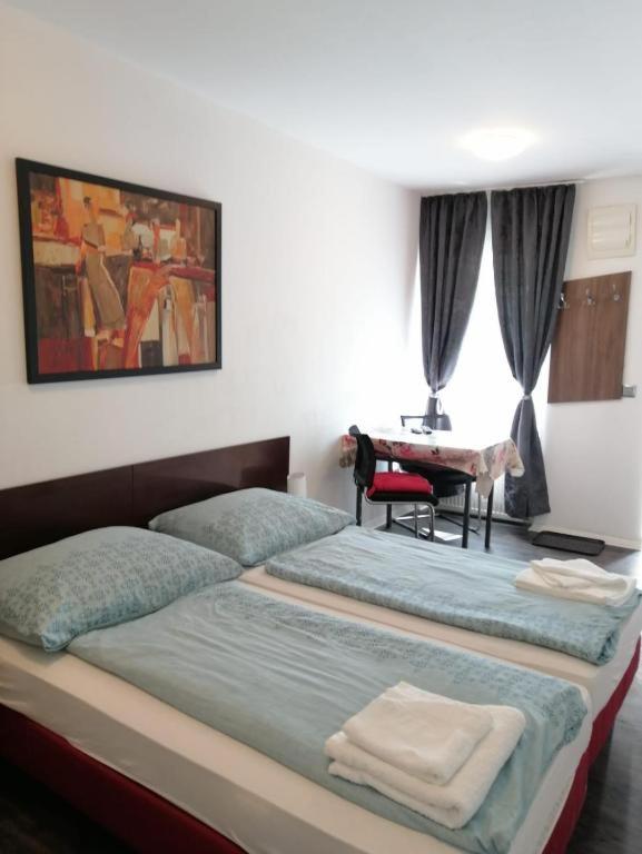 Postel nebo postele na pokoji v ubytování Apartmenthaus beim LKH Graz