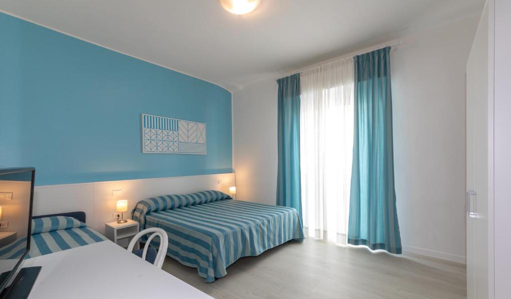 Postel nebo postele na pokoji v ubytování Hotel Paolina