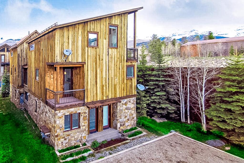 a large wooden house with a stone facade at Boulders Way - 15 in Telluride