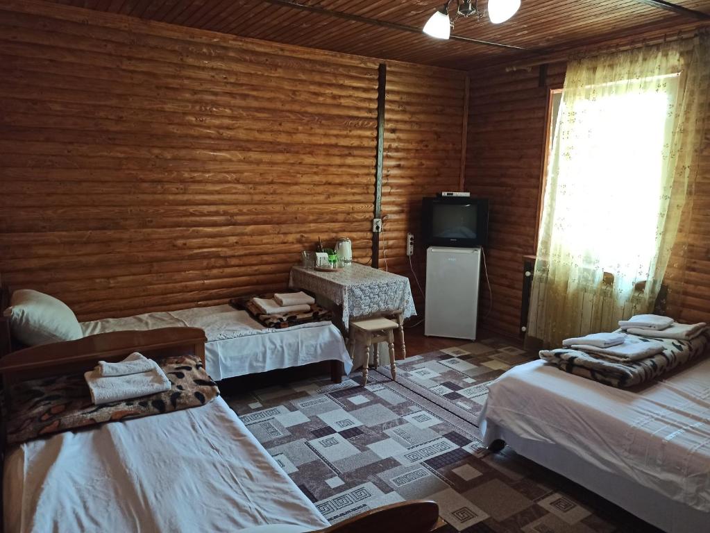 Postel nebo postele na pokoji v ubytování Садиба Каньйон