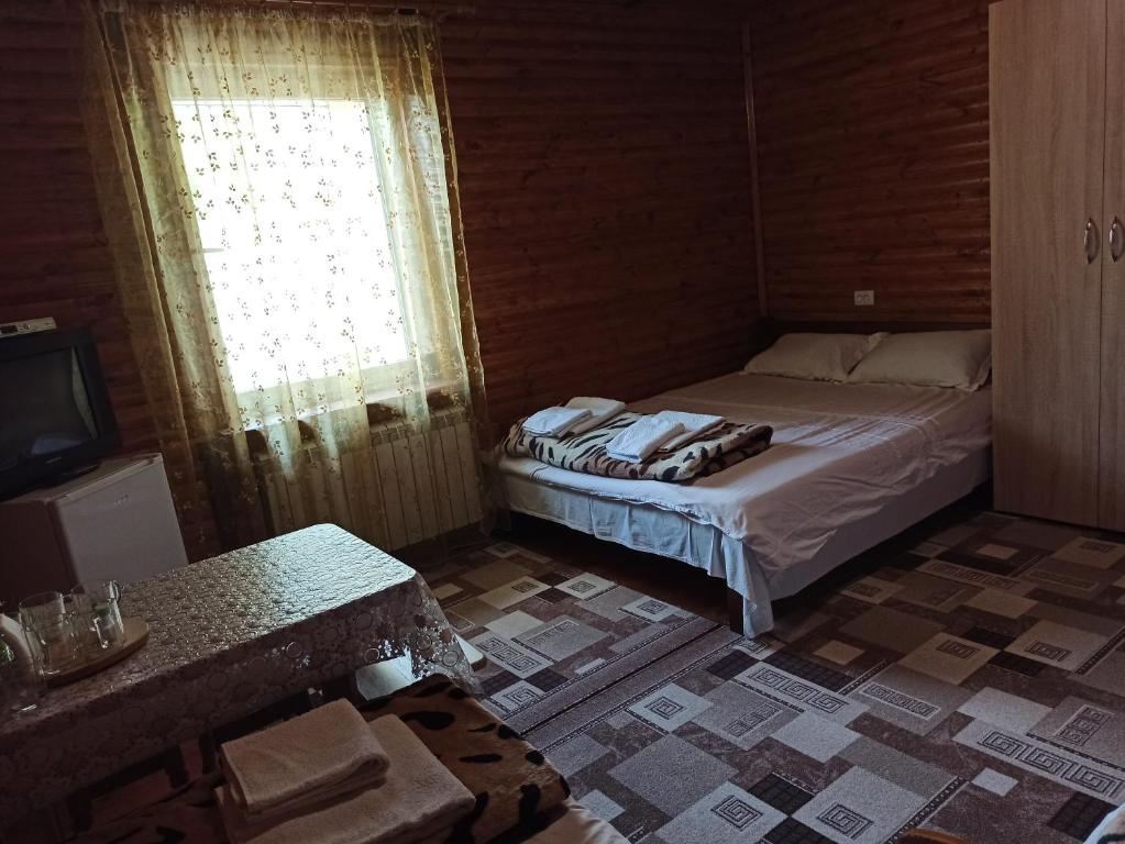 Postel nebo postele na pokoji v ubytování Садиба Каньйон