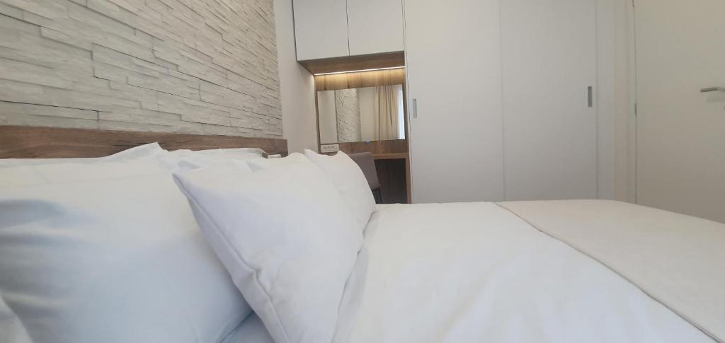 Posteľ alebo postele v izbe v ubytovaní Apartments Elite
