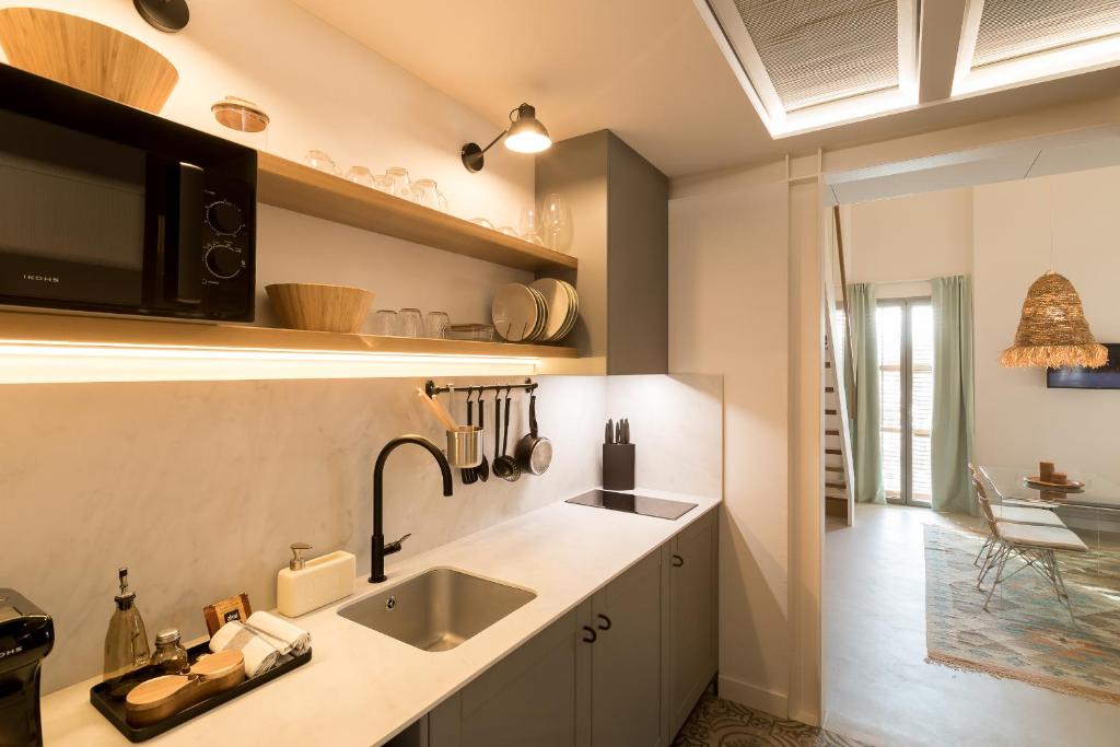 Kuchyň nebo kuchyňský kout v ubytování Hotel Portmany