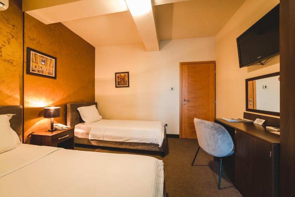 Ένα ή περισσότερα κρεβάτια σε δωμάτιο στο Hotel Keto