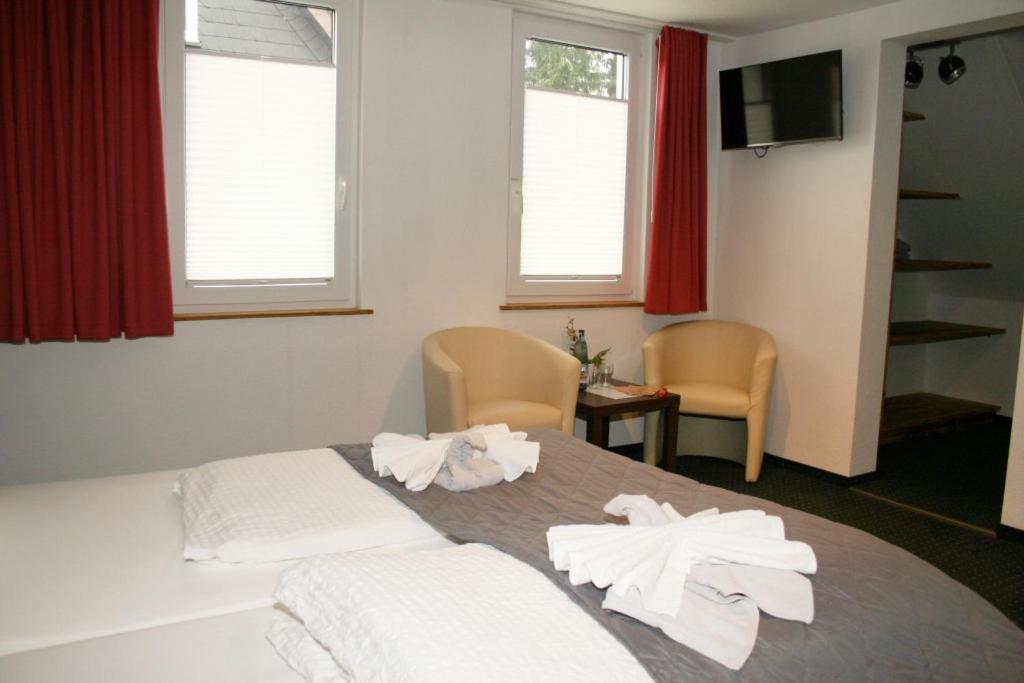 Postel nebo postele na pokoji v ubytování Dein Hotel