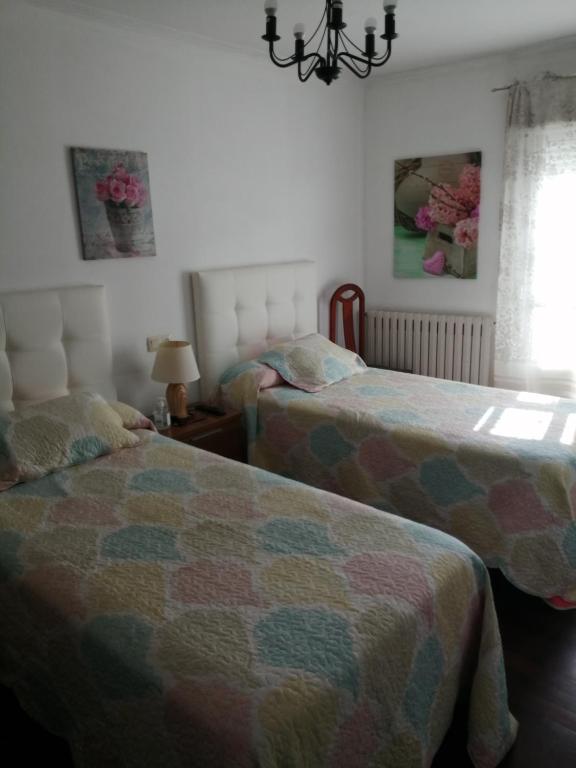 Posteľ alebo postele v izbe v ubytovaní Pensión Casa Frade