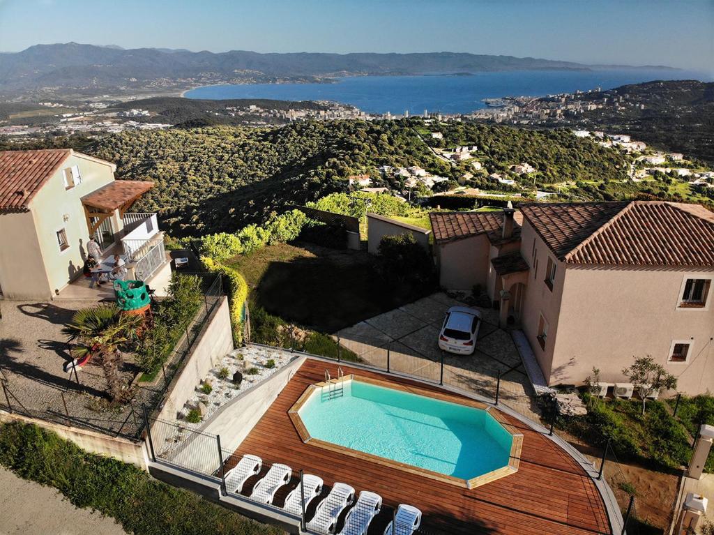 an aerial view of a house with a swimming pool at Gîtes Sassone in Alata