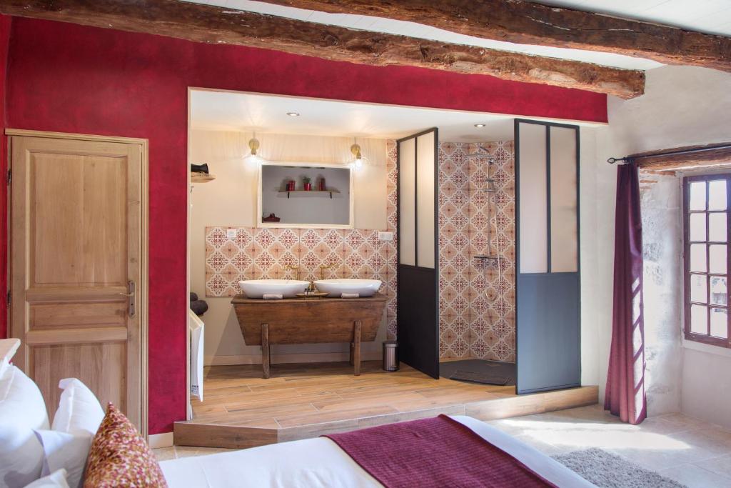 Postel nebo postele na pokoji v ubytování Maison Lapopie chambres et gîte
