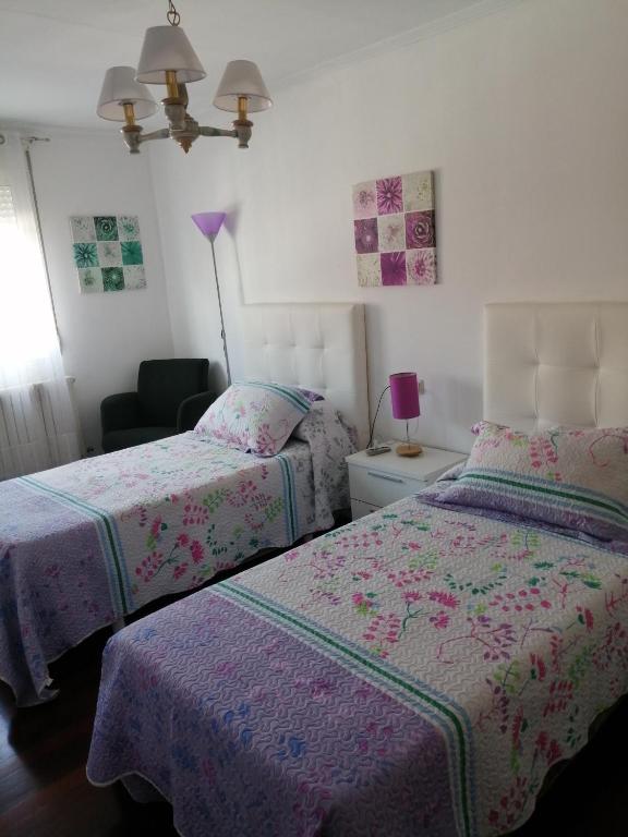 Posteľ alebo postele v izbe v ubytovaní Pensión Casa Frade