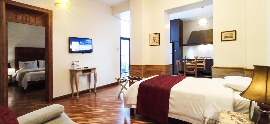 Postel nebo postele na pokoji v ubytování Casa Joaquin Boutique Hotel