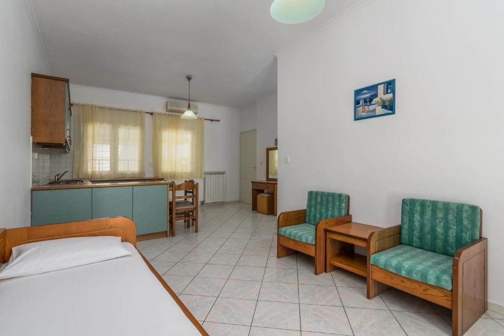 Postel nebo postele na pokoji v ubytování Tina's Apartments