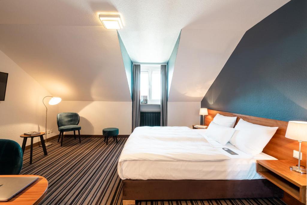 Postel nebo postele na pokoji v ubytování Hotel Stachus