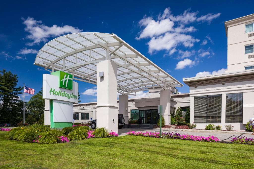 a hilton garden inn sign in front of a building at Holiday Inn Salem, an IHG Hotel in Salem