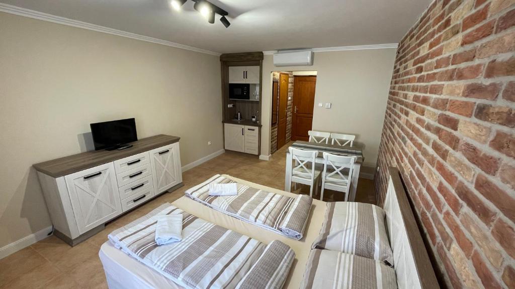 Łóżko lub łóżka w pokoju w obiekcie Dalma Apartment